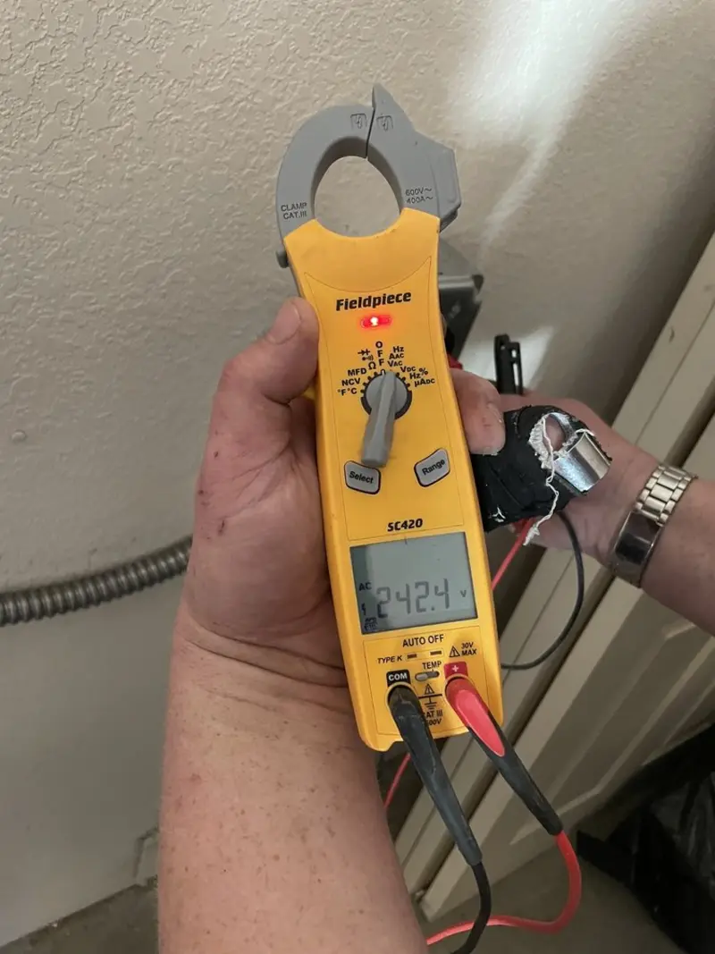 Voltage testing with clamp meter during Electrical Installation Services in Atlantic Beach